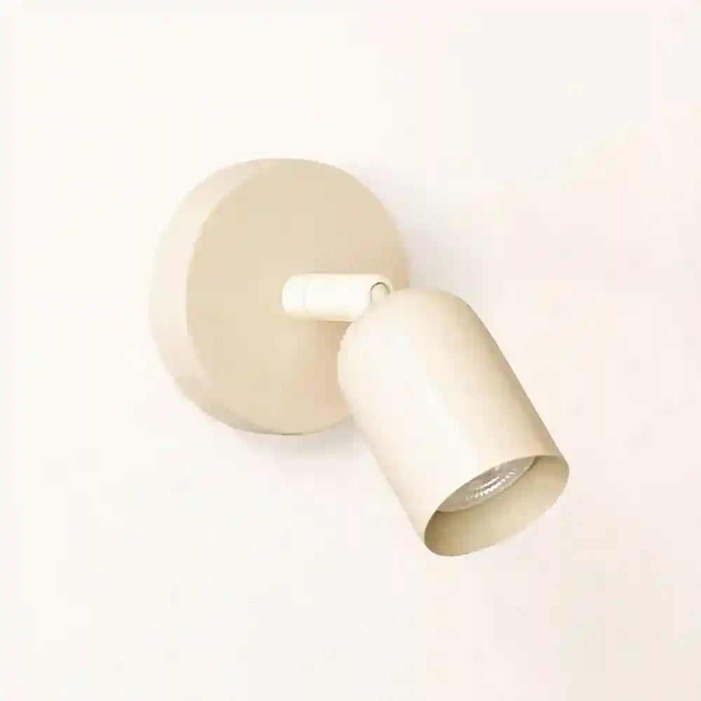 Beige wall-mounted light fixture on a white background