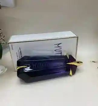 Black and gold product with a white box labeled 'MUTT' on a light surface.