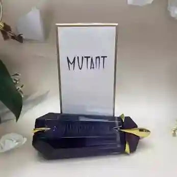 Black and gold rectangular object with 'MUTANT' text on a white background