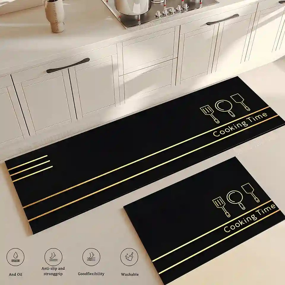 Black kitchen mats with 'Cooking Time' text and icons on a light-colored floor.