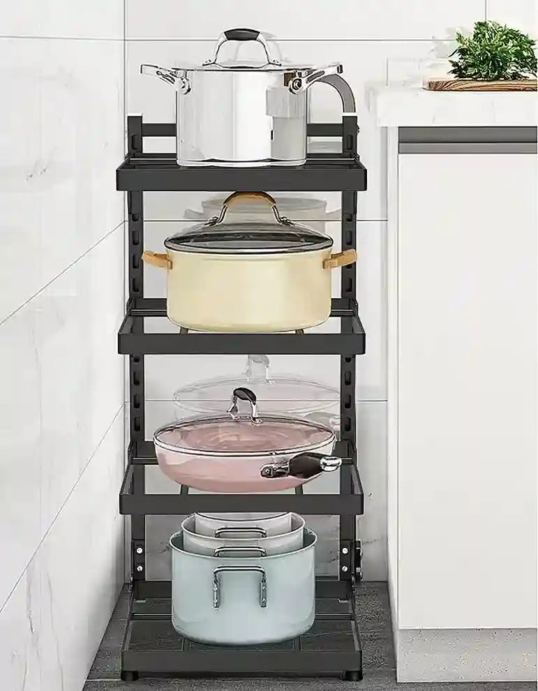 Black multi-tiered kitchen storage rack with pots and pans on a tiled floor.
