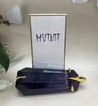 Blue box with gold accents labeled 'Mutant' on a white surface.