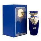 Blue perfume bottle and packaging with gold accents on a white background