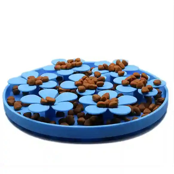 Blue pet toy with food distribution pattern on a white backgroaund