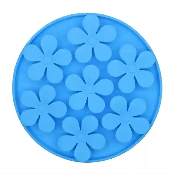 Blue silicone mold with flower shapes on a white background