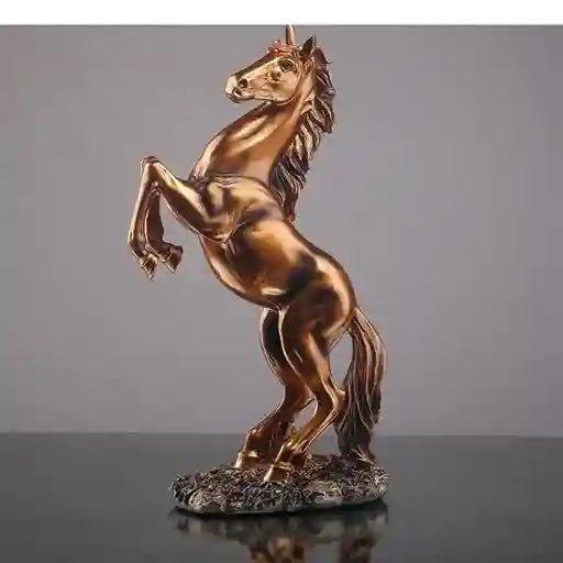 Bronze horse statue on a reflective surface with a gray background