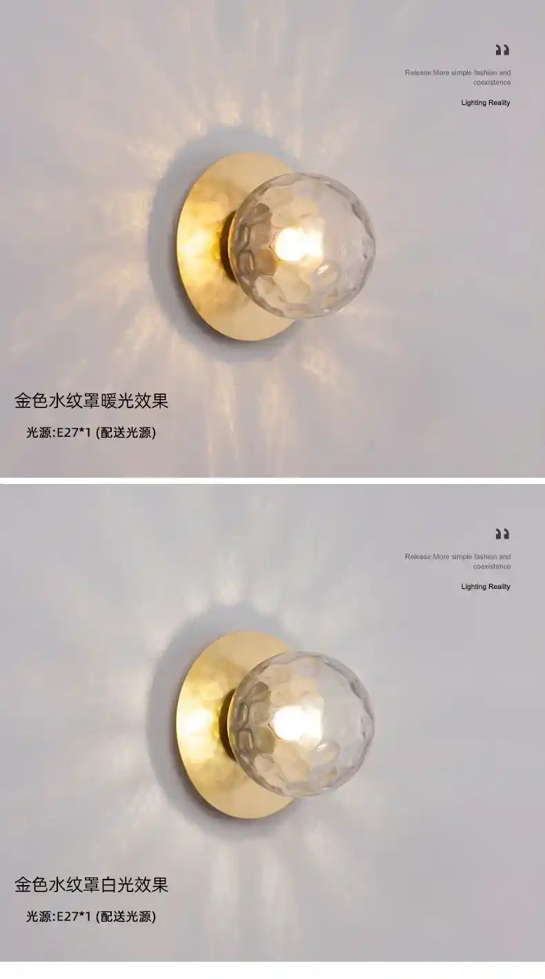 Two wall lights with gold fixtures and glass shades on a white background.