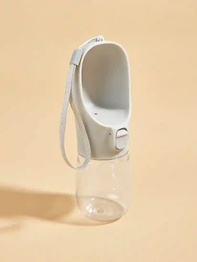 Clear water bottle with a white cap and strap on a beige background