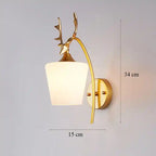 Decorative wall lamp with deer antlers on a gray background