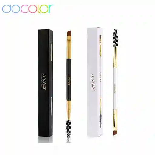 Docolor eyebrow brush with black and gold handle, white packaging, and black bristle head on a white background.