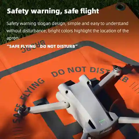 Drone on an orange apron with safety warning text
