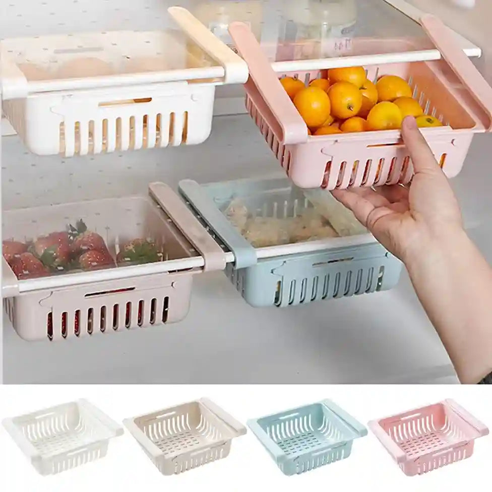 Foldable fruit and vegetable storage baskets with a hand holding one, shown on a refrigerator door.