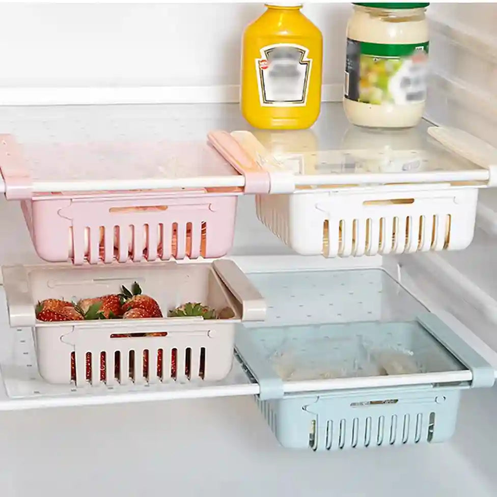 Fridge shelves with colorful baskets holding fruits and vegetables inside a refrigerator.