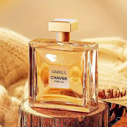 Gabelil Chavnk perfume bottle on a wooden surface with a soft, warm background