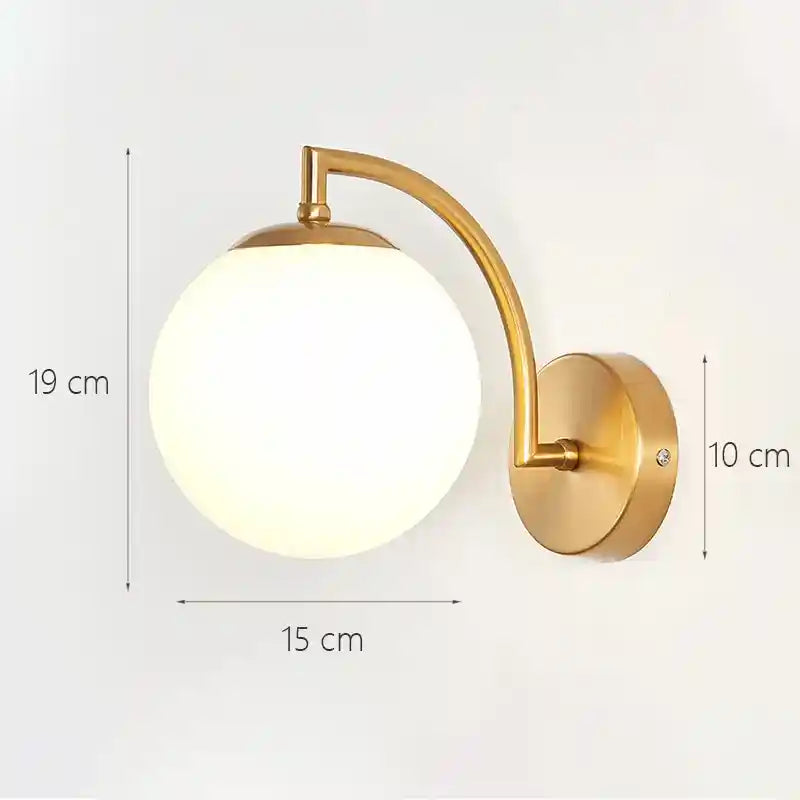Gold wall lamp with dimensions on a white background