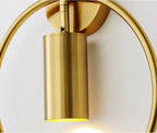 Gold wall sconce on a white background
