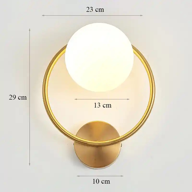 Gold wall sconce with dimensions labeled on a light gray background