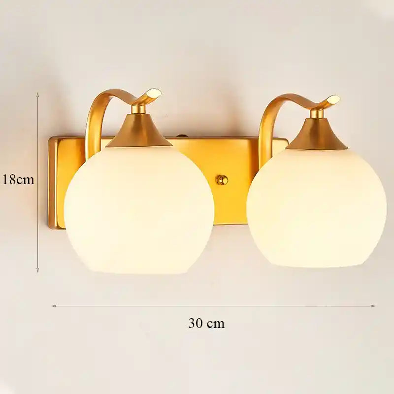 Gold wall sconces with glass shades on a white background, showing dimensions.