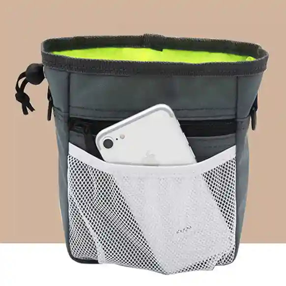 Gray and green pouch with a phone in a pocket on a beige background