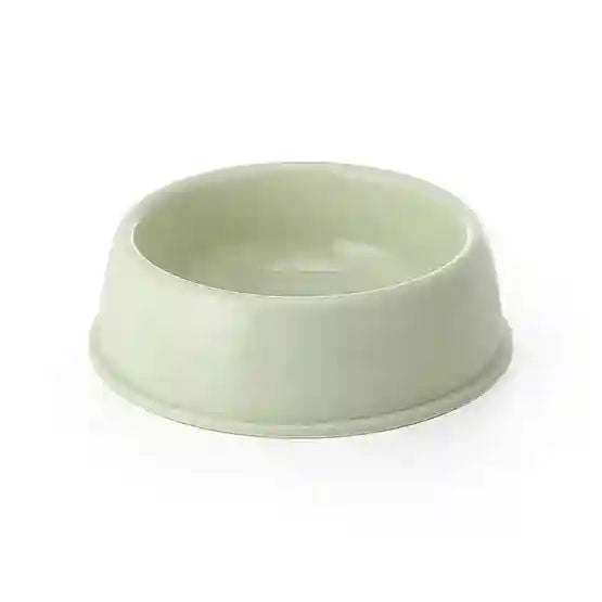 Green ceramic bowl on a white background