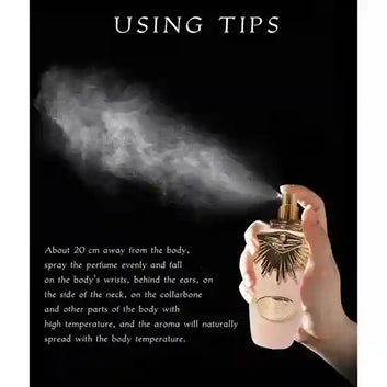 Hand holding a perfume spray with usage tips on a black background