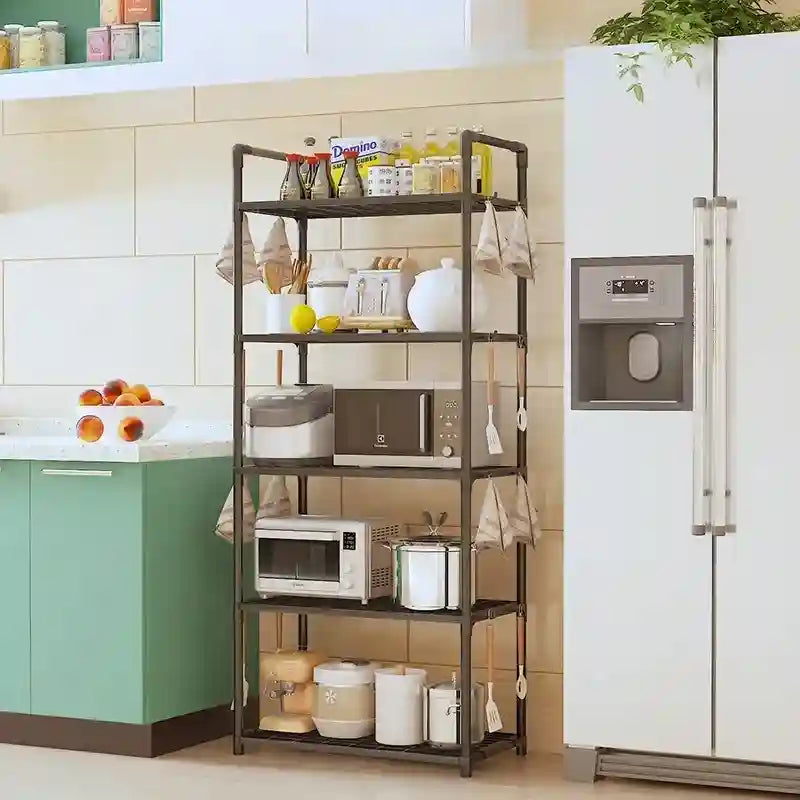 Kitchen shelf with appliances and items against a tiled wall and refrigerator.