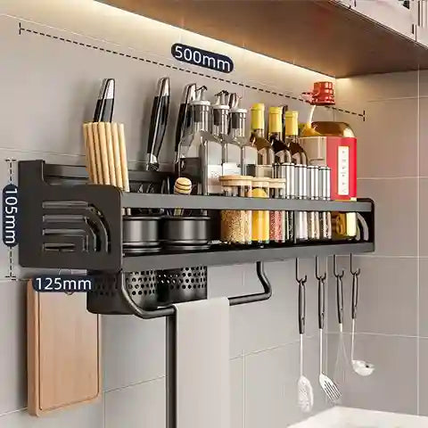 Kitchen wall-mounted rack with various utensils and containers on a tiled wall.
