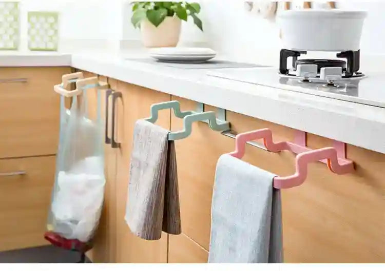 Multifunctional kitchen rack with various attachments on a kitchen counter.