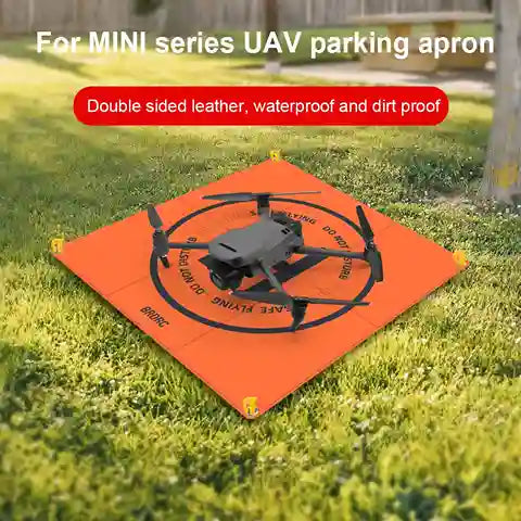 Orange UAV parking apron with a drone on grass, labeled for MINI series UAV.