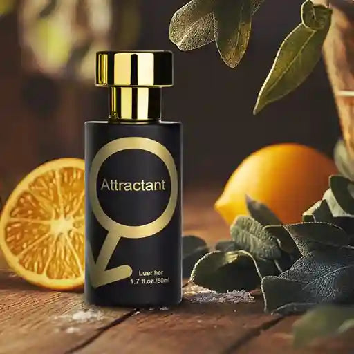 Perfume bottle labeled 'Attractant' with oranges and leaves on a wooden surface