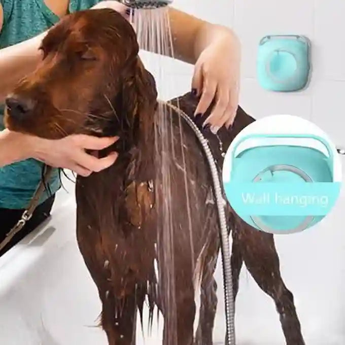 Person washing a dog with a shower head, featuring a wall-mounted pet shower head in the corner.