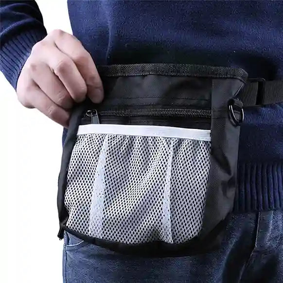 Person wearing a black waist bag with a mesh pocket.