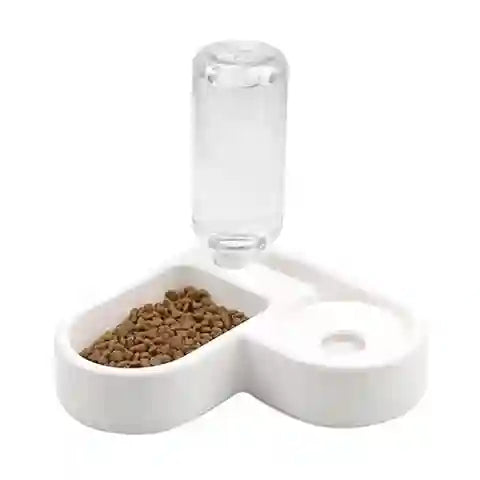 Pet food dish with a water bottle attachment on a white background