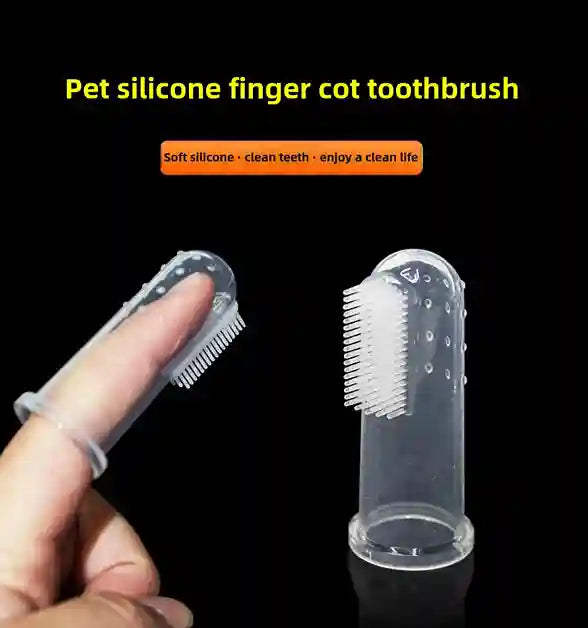 Pet silicone finger cot toothbrush with a hand holding it against a black background