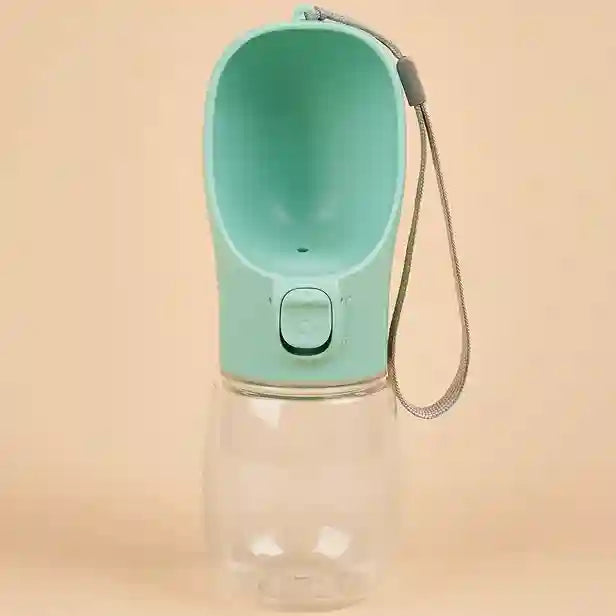 Pet water bottle with a green top and clear body on a beige background