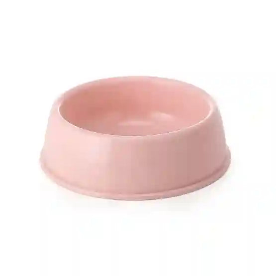 Pink ceramic bowl on a white background