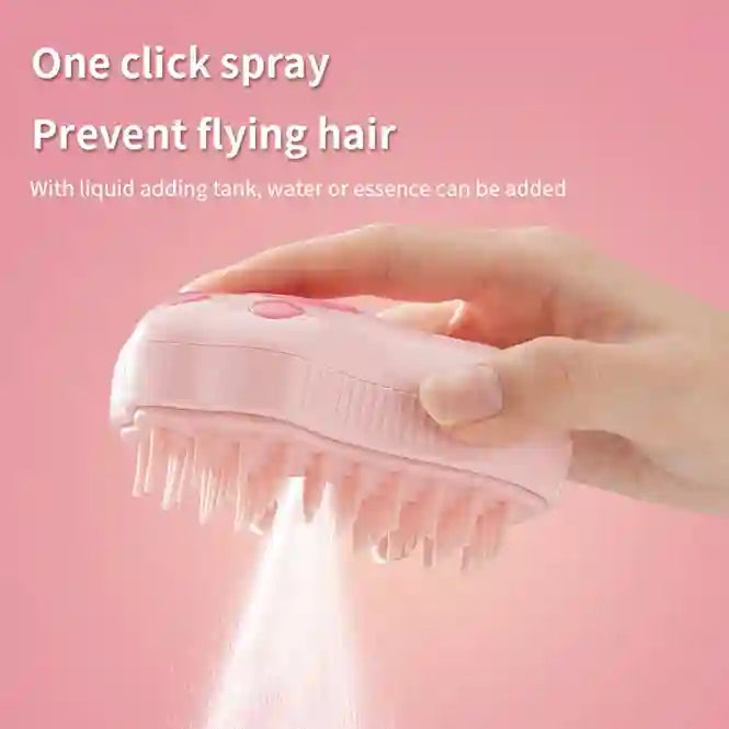 Pink hairbrush with spray feature held by a hand against a pink background