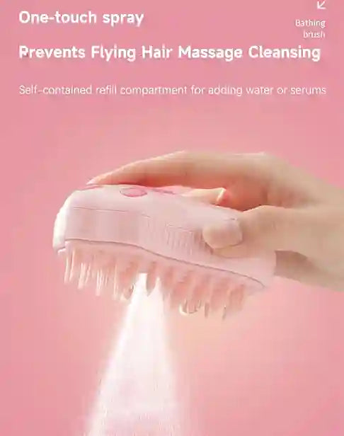 Pink hairbrush with water spray on a pink background