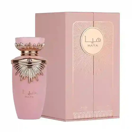 Pink perfume bottle with gold accents and matching box featuring 'Lila Haya' branding on a white background.