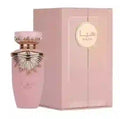 Pink perfume bottle with gold cap and matching box on a white background