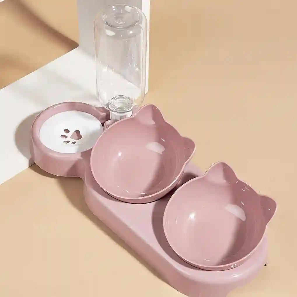 Pink pet bowl set with two bowls and a water dispenser on a beige background