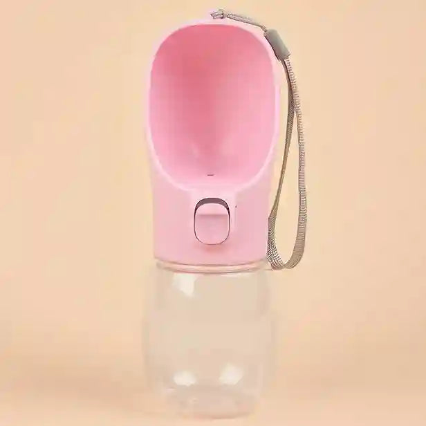Pink pet water bottle with a clear base on a beige background