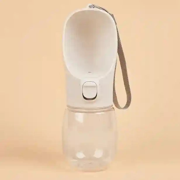 Portable water bottle with a strap on a beige background