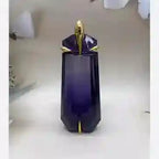 Purple decorative item with gold accents on a white background