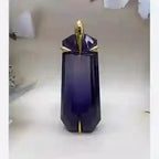 Purple decorative item with gold accents on a white surface