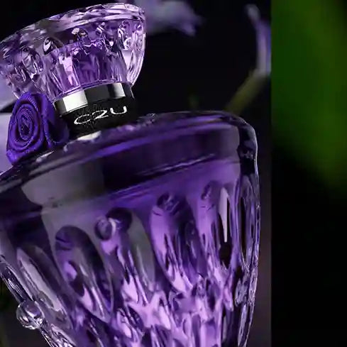 Purple perfume bottle with decorative cap featuring a rose and 'C2U' branding.