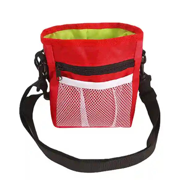 Red dog training treat pouch with a black strap on a white background