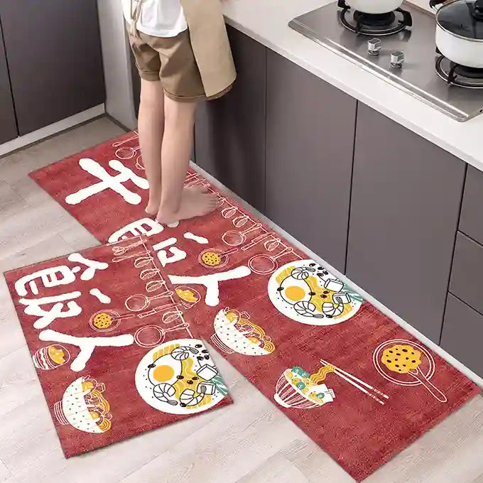 Red kitchen mats with food illustrations on a wooden floor