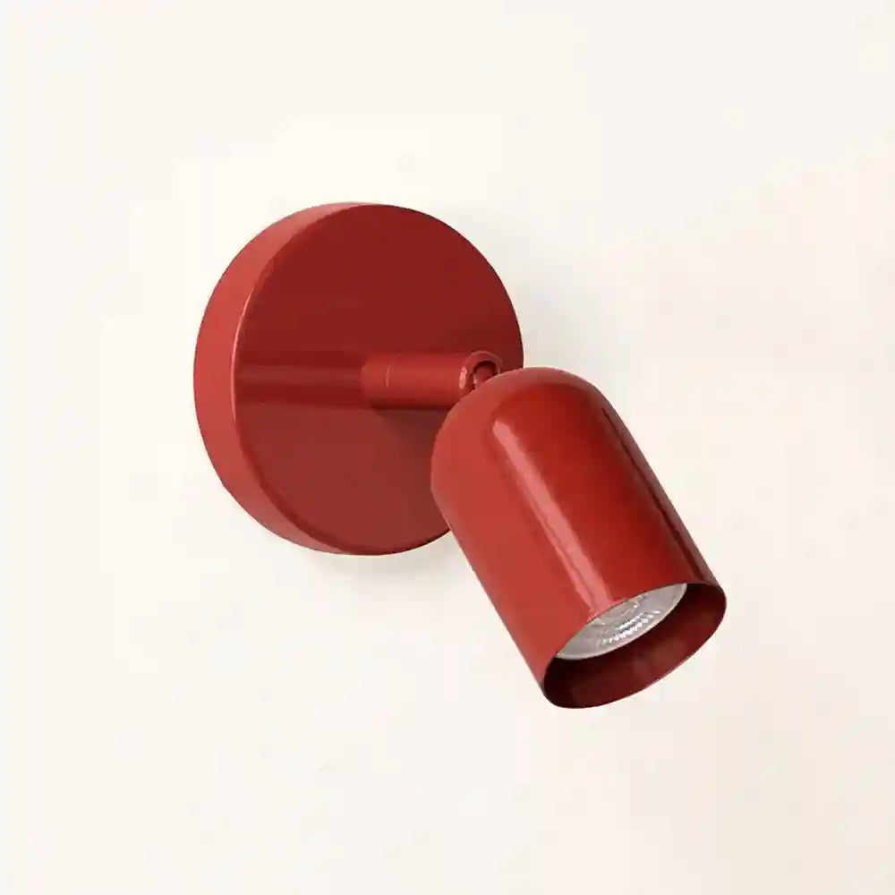 Red wall light fixture on a white background