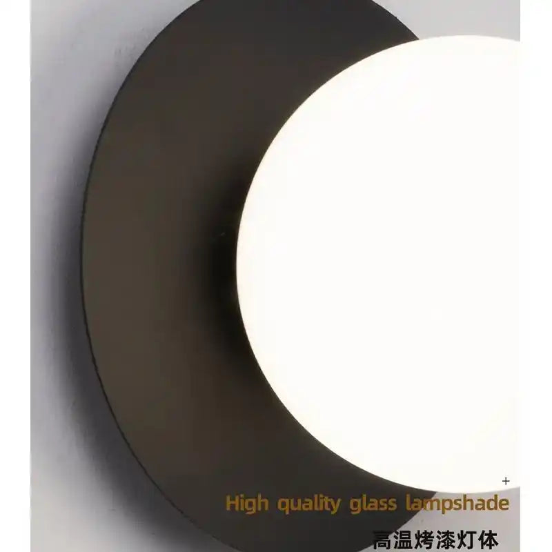 Round black lampshade with a white interior on a gray background